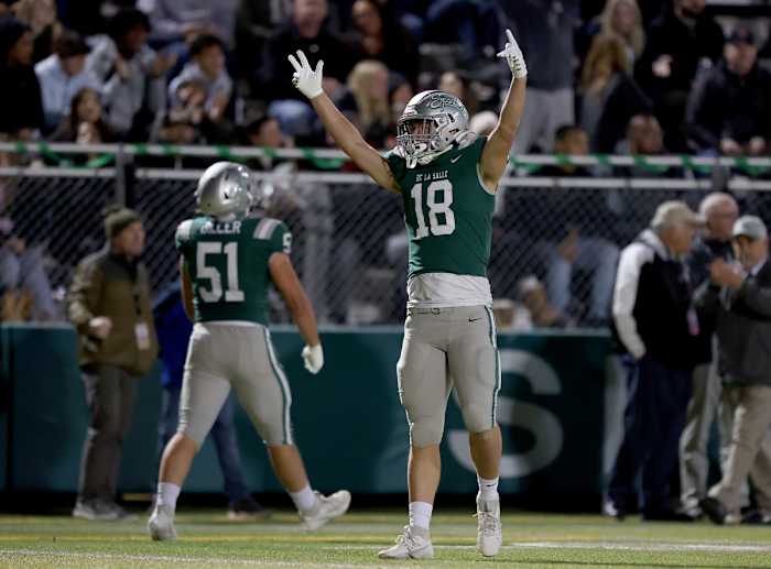 Drew Cunningham (18) and Chris Biller (51) celebrate 41-0 win over Clovis North in the CIF Division 1-AA championship game on Dec. 1.